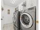 Spacious laundry room with modern washer and dryer and plenty of storage at 11808 Lancashire Dr, Tampa, FL 33626
