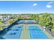 Aerial view of well-maintained community tennis courts surrounded by lush greenery at 11808 Lancashire Dr, Tampa, FL 33626
