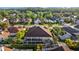 Beautiful aerial shot of the property showcasing a private screened-in pool and lush landscaping at 11906 Middlebury Dr, Tampa, FL 33626