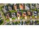 An aerial view of a neighborhood, highlighting mature trees and swimming pools at 11906 Middlebury Dr, Tampa, FL 33626
