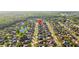 An aerial view of a neighborhood with mature trees, lush lawns, and a beautiful lake at 11906 Middlebury Dr, Tampa, FL 33626