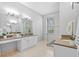 A bright bathroom featuring double sinks, sleek countertops, and a luxurious glass-enclosed shower at 11906 Middlebury Dr, Tampa, FL 33626