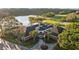 Elegant clubhouse featuring classic brick design, lush landscaping, and prominent American flag at 11906 Middlebury Dr, Tampa, FL 33626