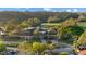 Beautiful clubhouse with lush surroundings, parking area, and view to golf course at 11906 Middlebury Dr, Tampa, FL 33626