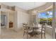Cozy dining room with natural light, tile flooring, and a view of the outdoor space at 11906 Middlebury Dr, Tampa, FL 33626