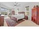 Spacious bedroom with a large bed, an area rug, natural light, and access to an outdoor living space at 11906 Middlebury Dr, Tampa, FL 33626