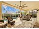 Inviting screened patio features comfortable seating and a pristine pool at 11906 Middlebury Dr, Tampa, FL 33626
