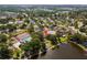 Aerial view with property location highlighted, near tennis courts, pool, and lake at 1208 Sawgrass Ct, Oldsmar, FL 34677