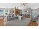 Open-concept living space with a view of the dining area, kitchen, and modern decor at 1208 Sawgrass Ct, Oldsmar, FL 34677