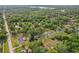 Overhead view of the house, pond, and expansive wooded land at 1226 Debuel Rd, Lutz, FL 33549