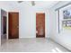 Bedroom with tile floor, closet and window providing natural light at 1226 Debuel Rd, Lutz, FL 33549