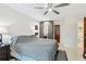 Bright bedroom featuring tile floor, ceiling fan, and closet at 1226 Debuel Rd, Lutz, FL 33549