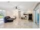 Spacious living area with tile floors and sliding glass doors at 1226 Debuel Rd, Lutz, FL 33549