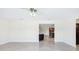 Open-concept living room featuring tile flooring with view of the kitchen at 1226 Debuel Rd, Lutz, FL 33549