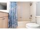 Cozy bathroom with a seashell shower curtain at 1231 Corinth Greens Dr, Sun City Center, FL 33573