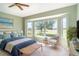 Airy bedroom features golf course views, a ceiling fan, bay window and eclectic decor at 1231 Corinth Greens Dr, Sun City Center, FL 33573