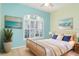 Inviting bedroom with shuttered window and tranquil decor at 1231 Corinth Greens Dr, Sun City Center, FL 33573