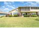Beautiful home with large windows, manicured lawn and well-maintained landscaping at 1231 Corinth Greens Dr, Sun City Center, FL 33573