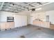 Large garage with ample storage cabinets and shelving at 1231 Corinth Greens Dr, Sun City Center, FL 33573