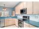Updated kitchen with stainless steel appliances and ample counter space at 1231 Corinth Greens Dr, Sun City Center, FL 33573