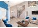 Bright living room features tile floors, comfortable seating, and elegant chandelier at 1231 Corinth Greens Dr, Sun City Center, FL 33573