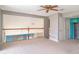 Upstairs loft area featuring carpet and railing at 1231 Corinth Greens Dr, Sun City Center, FL 33573