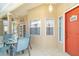 Screened-in porch with an outdoor table and chairs, and tile flooring at 1231 Corinth Greens Dr, Sun City Center, FL 33573