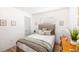 Cozy bedroom with a comfortable bed, decorative pillows, and a plant at 12317 Smokey Dr, Hudson, FL 34669
