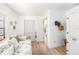 Bright secondary bedroom with light color and views to the exterior of the home at 12317 Smokey Dr, Hudson, FL 34669