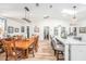 Dining room with wood table and modern lighting fixtures at 12317 Smokey Dr, Hudson, FL 34669