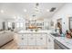 Modern kitchen featuring an island with a marble countertop and stainless steel appliances at 12317 Smokey Dr, Hudson, FL 34669