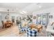 Bright open-concept living space with hardwood floors, a dining area, and a modern kitchen at 12317 Smokey Dr, Hudson, FL 34669
