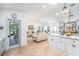 Open-concept living space featuring a modern kitchen and hardwood floors at 12317 Smokey Dr, Hudson, FL 34669