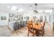 Open-concept living space featuring a modern kitchen and hardwood floors at 12317 Smokey Dr, Hudson, FL 34669
