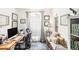 Bright home office with a large window, desk, comfortable seating, and decorative pillows at 12317 Smokey Dr, Hudson, FL 34669