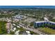 Aerial view of building near a large parking lot, surrounded by lush greenery and waterfront at 1241 N Mcmullen Booth Rd, Clearwater, FL 33759