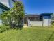 A well-maintained lawn enhances the home's exterior at 1241 N Mcmullen Booth Rd, Clearwater, FL 33759