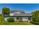 A home with lush landscaping, enhancing curb appeal at 1241 N Mcmullen Booth Rd, Clearwater, FL 33759