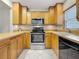 Functional kitchen with stainless steel appliances, ample cabinet space, and tile flooring at 1241 N Mcmullen Booth Rd, Clearwater, FL 33759