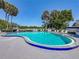 Inviting community pool with deck chairs at 1241 N Mcmullen Booth Rd, Clearwater, FL 33759