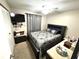 Bedroom with a ceiling fan, neutral decor, carpet flooring, and a closet at 13924 Pathfinder Dr, Tampa, FL 33625