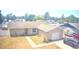 Aerial view of a single-story home with attached garage and a modest front yard needing some TLC at 13924 Pathfinder Dr, Tampa, FL 33625