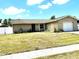 Charming single-story home with a well-maintained lawn and an attached one-car garage at 13924 Pathfinder Dr, Tampa, FL 33625