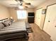 Bedroom featuring a ceiling fan, neutral colors, carpet, and closet space at 13924 Pathfinder Dr, Tampa, FL 33625