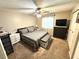 Cozy bedroom featuring a ceiling fan, neutral decor, carpet, and closet space at 13924 Pathfinder Dr, Tampa, FL 33625