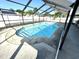 A screened-in pool provides outdoor enjoyment and relaxation at 13924 Pathfinder Dr, Tampa, FL 33625