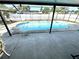 Backyard pool area with enclosed lanai at 13924 Pathfinder Dr, Tampa, FL 33625