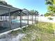 Back yard with enclosed lanai at 13924 Pathfinder Dr, Tampa, FL 33625