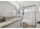 Updated bathroom featuring granite countertops, subway tile shower, and stylish finishes at 1517 Little Brook Ln, Brandon, FL 33511