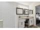 Bathroom with double vanity, granite countertops and subway tile at 1517 Little Brook Ln, Brandon, FL 33511